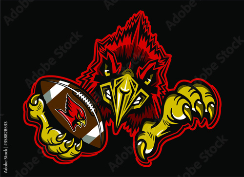 cardinal football team mascot holding ball in claw for school, college or league