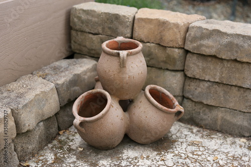 Brown garden stacked ceramic pots © georowe