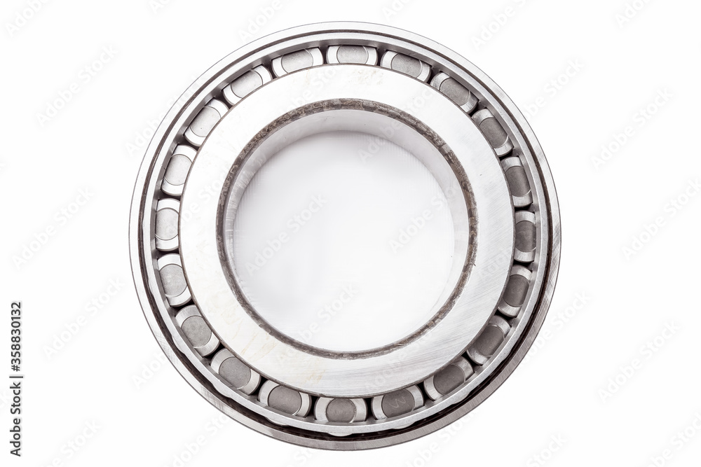 Single row tapered roller bearing made of chromed metal is designed to absorb radial and one-sided axial loads on the undercarriage of a vehicle. Sale spare parts or repairs in workshop or car service Single row tapered roller bearing made of chromed metal is designed to absorb radial and one-sided axial loads on the undercarriage of a vehicle. Sale spare parts or repairs in workshop or car service