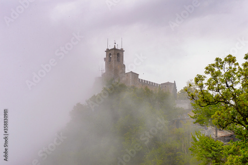 The fortress of Guaita on Mount Titano on a foggy day, the UNESCO World Heritage since 2008