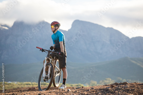 Close up portrait of a mountain biker on his mountain bike on a bike track