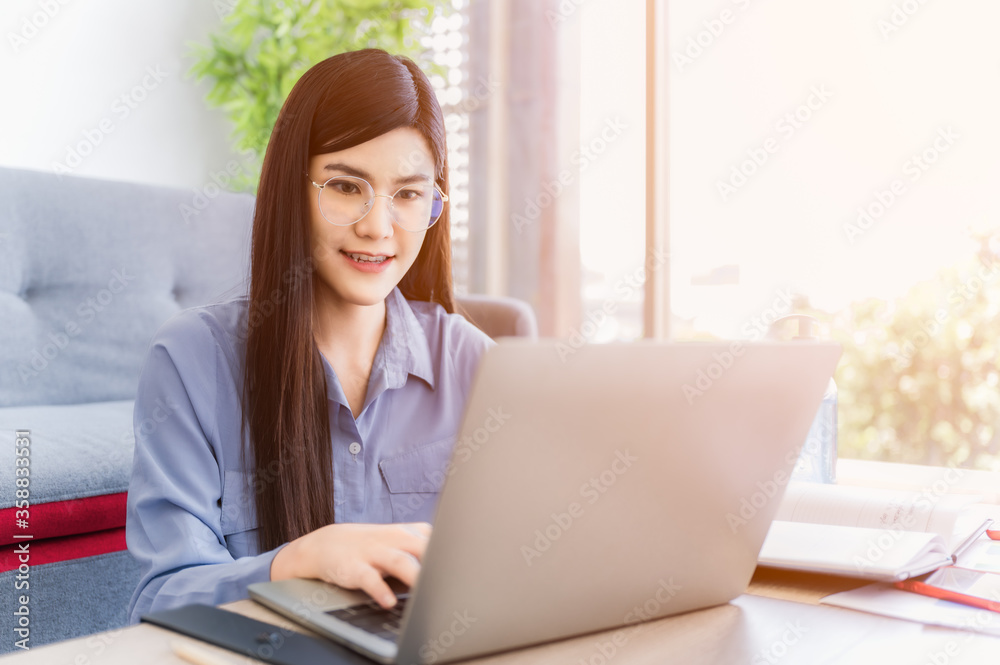 Beautiful asian businesswoman working at home Beautiful asian businesswoman working at home
