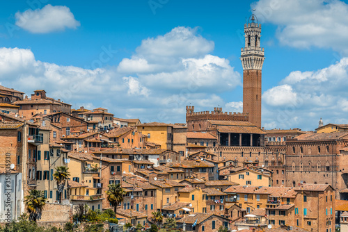 The skyline of the historic centre of Siena with the back of the Palazzo Pubblico and the Torre del Mangia from near the Monastero di Sant Agostino.