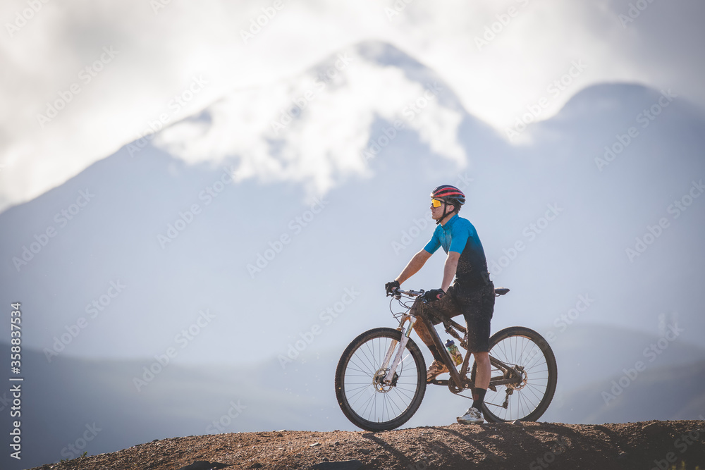 Close up image of a mountain biker speeding downhill on a mountain bike track Close up image of a mountain biker speeding downhill on a mountain bike track