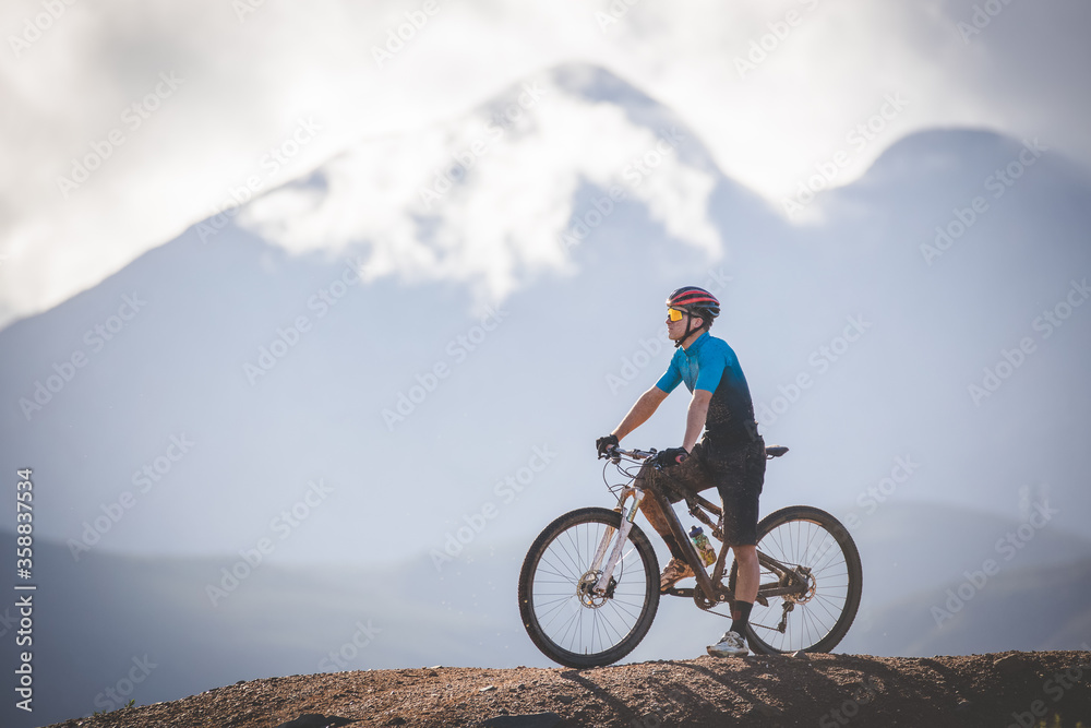 Close up image of a mountain biker speeding downhill on a mountain bike track