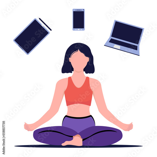 Concept of a woman practicing yoga in her free time. Rest from work and gadgets. Yoga and meditation. Girl sitting in lotus position