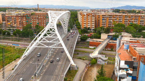 Aerial view of the Settimia Spizzichino bridge known as Ostiense overpass. This iron arch bridge is located in the Garbatella district in Rome, Italy photo