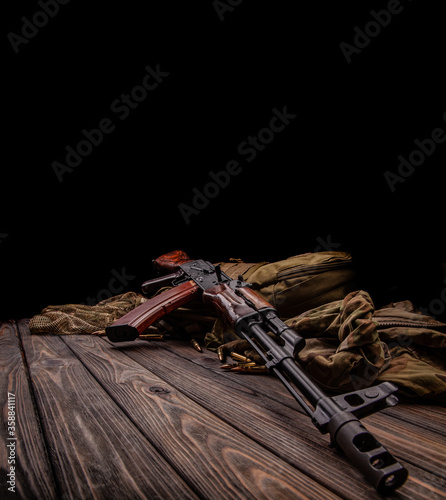 Classic Soviet AK machine gun on a wooden back. Weapons of Russia and the Soviet Union.