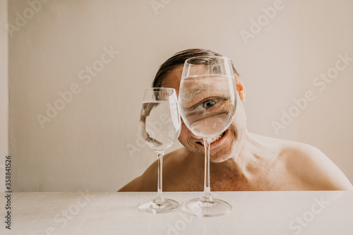Portrait of man looking through glass
