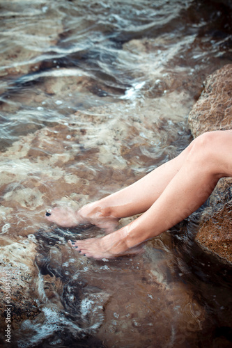 Young Woman Foot in the Clean Sea Water