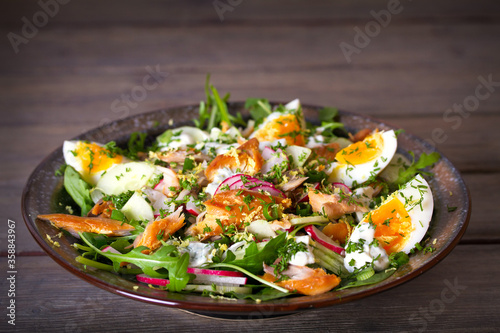 Smocked mackerel salad with eggs and radish. Healthy diet food