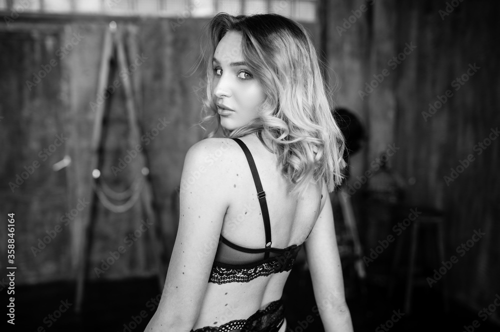 Close up monochrome portrait of curly blond charming woman. Close up monochrome portrait of curly blond charming woman.