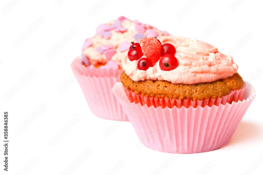 Vanilla muffins with whipped cream, currants and decorative sprinkles Vanilla muffins with whipped cream, currants and decorative sprinkles