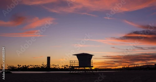 Wallpaper Mural Beautiful timelapse sunset ocean with clouds and lifeguard tower and cranes in bacground in Long Beach. Los Angeles, California. 4K Timelapse. Torontodigital.ca