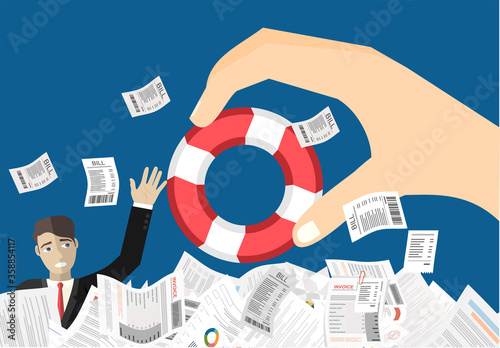 Man sticks out of a pile of papers. Another person is stretching a lifeline and wants to help. Helping Business to survive. Drowning businessman getting lifebuoy from another businessman photo