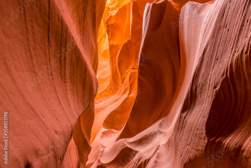 The high level walls glow in the morning sunlight in lower Antelope Canyon, Page, Arizona