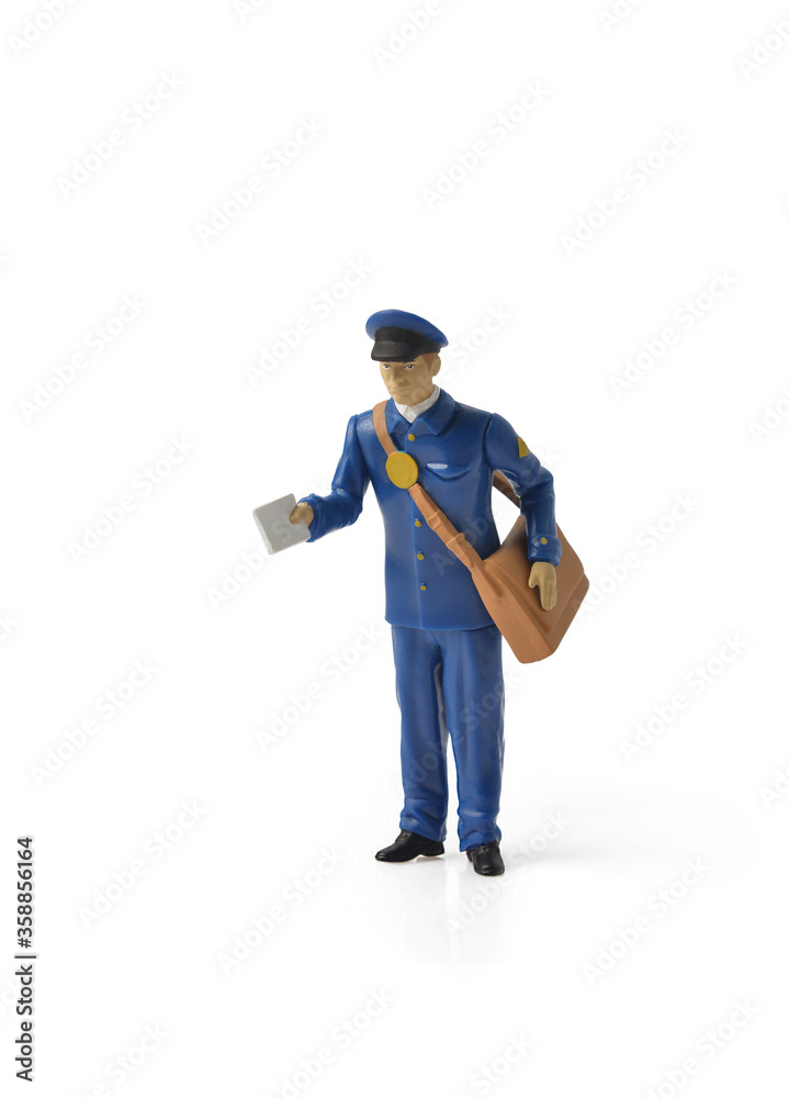 online purchases. Miniature mailmen figurine presents a letter. home delivery. Keep the distance to avoid contagion. Social distance concept for epidemic safety. Covid-19 and Coronavirus online purchases. Miniature mailmen figurine presents a letter. home delivery. Keep the distance to avoid contagion. Social distance concept for epidemic safety. Covid-19 and Coronavirus