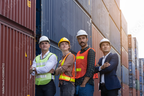 Portrait team of inspector engineers that work together efficiently until the work is completed successfully. In construction sites or in factories or warehouses
