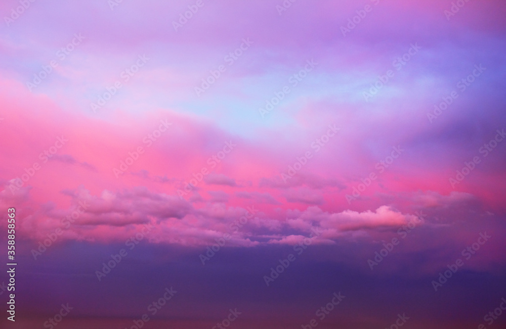 Beautiful scenic view of dramatic cloudy sky in pink, blue and violet tones at evening, Moscow region, Russia