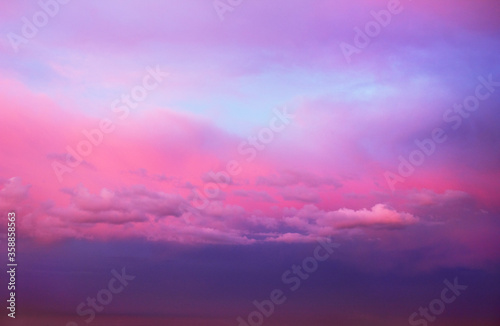 Beautiful scenic view of dramatic cloudy sky in pink, blue and violet tones at evening, Moscow region, Russia