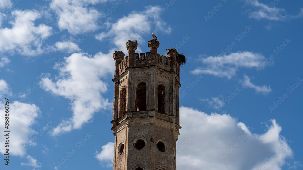 Destroyed Odzienas Castle in Latvia, Europe on a Beautiful Sunny Spring Day, Concept of Travel in Harmony on Countryside. Detail of the Ancient Castle With Tower. Stork's Nest in the Tower