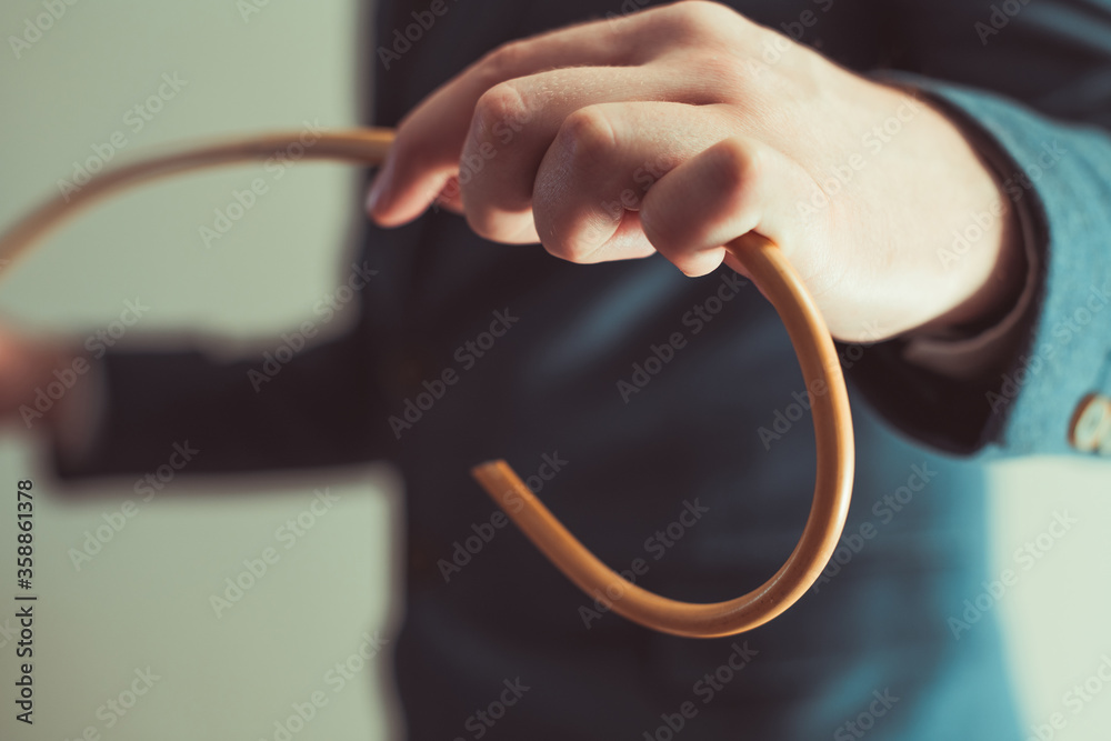 Man's hand with cane. Strict teacher with crooked rattan cane. School  discipline and corporal punishment concept. Spanking in school. Photos |  Adobe Stock