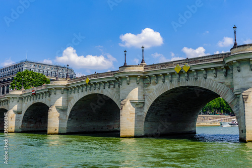 It's Pont Neuf, the oldest standing bridge across the river Seine in Paris, France.