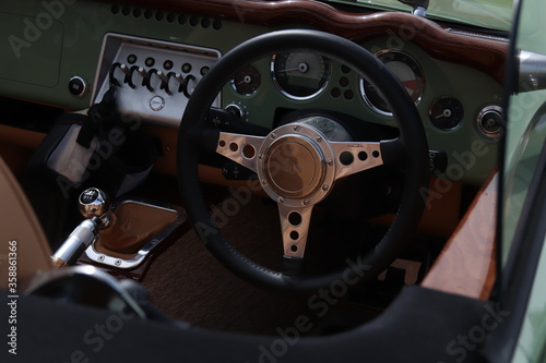vinatge morgan interior with furnished steering wheel, dashboard and gear stick