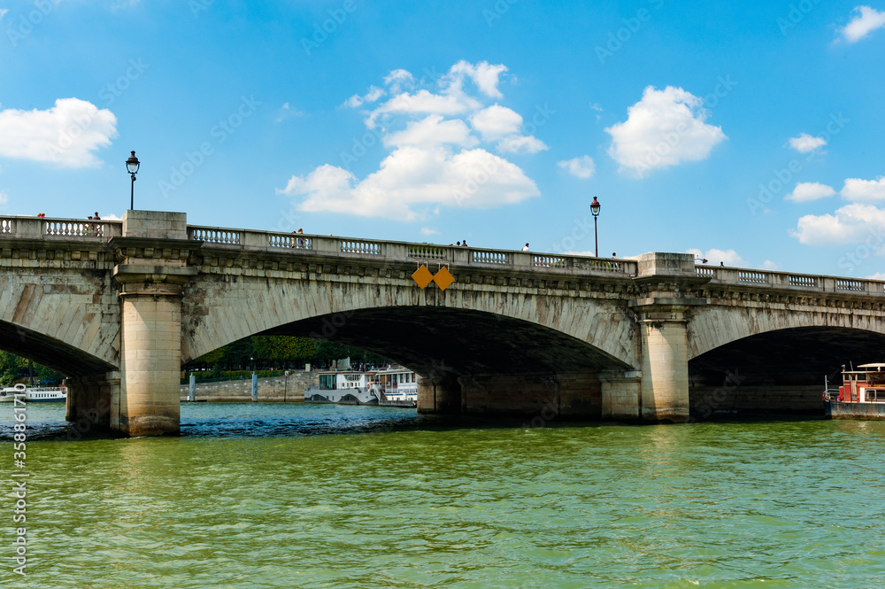 It's Pont de la Concorde (Concorde bridge), an arch bridge across the River Seine in Paris connecting the Quai des Tuileries at the Concorde Square and the Quai d'Orsay