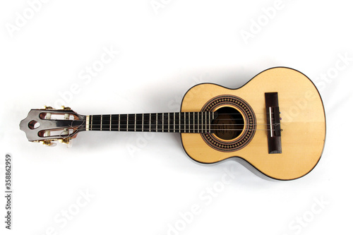 Light wooden ukulele on white background still