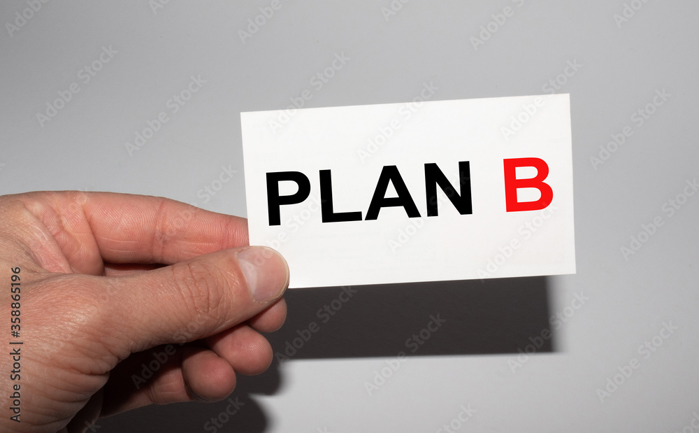 Message on the card plan B, in hands of businessman. Message on the card plan B, in hands of businessman.