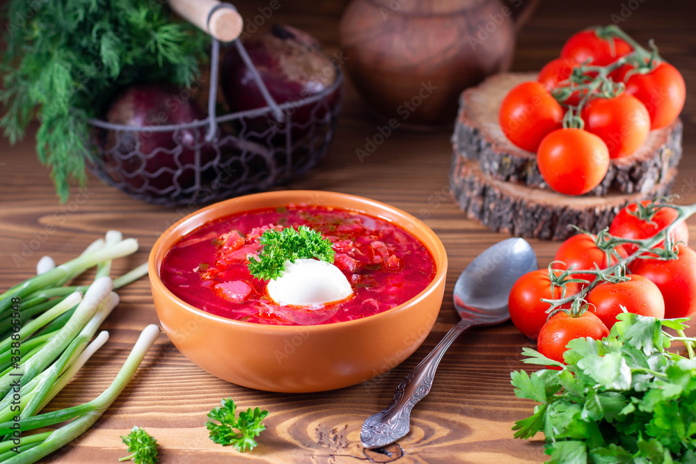 Borscht. Red soup in bowl with sour cream on wooden background. National ukrainian or russian red soup Borscht. Red soup in bowl with sour cream on wooden background. National ukrainian or russian red soup
