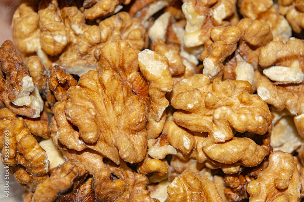Peeled walnuts close-up. Surface texture. Healthy diet. Peeled walnuts close-up. Surface texture. Healthy diet.