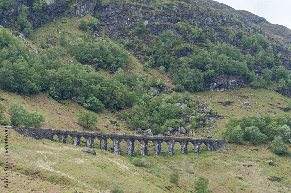Stone railway bridge near Crianlarich, Scotland. Concept: Scottish railways, mysterious ancient places, Scottish nature