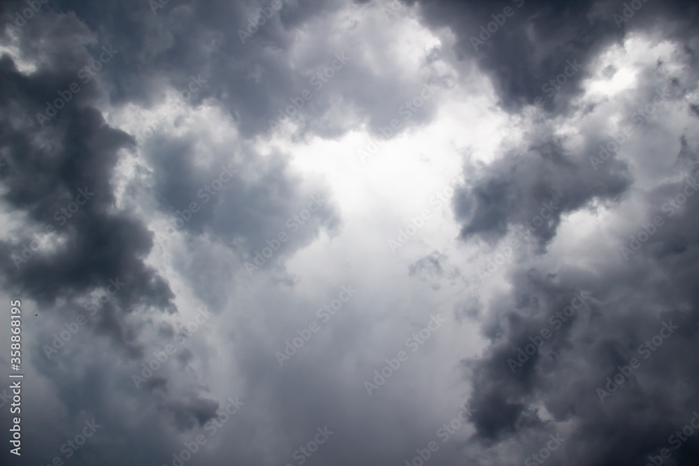 Fototapeta premium A beautiful stormy sky with clouds. The Dark heavy thunderstorm clouds before the rain. Dramatic cloudscape.