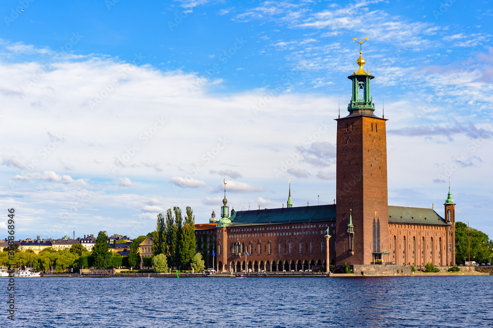 Stockholm City Hall, the building of the Municipal Council for the City of Stockholm in Sweden over the lake Malaren