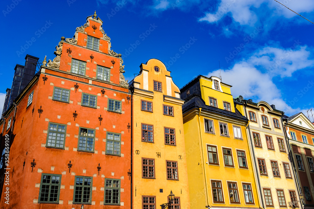 Fototapeta premium Red and Yellow iconic buildings on Stortorget, a small public square in Gamla Stan, the old town in central Stockholm, Sweden.