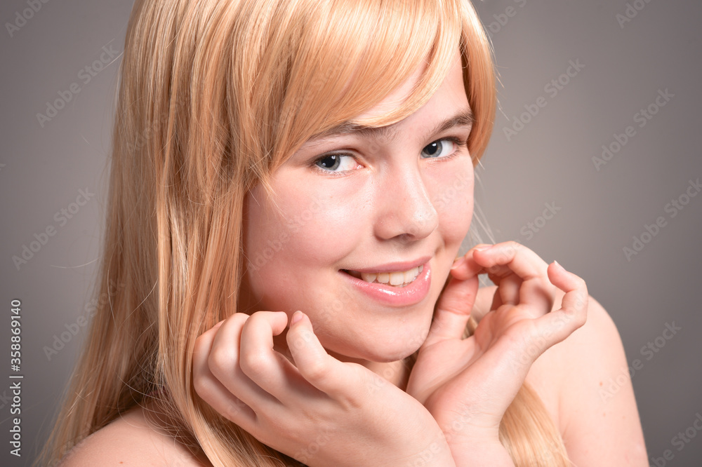 Portrait of cute blonde girl posing in studio Portrait of cute blonde girl posing in studio