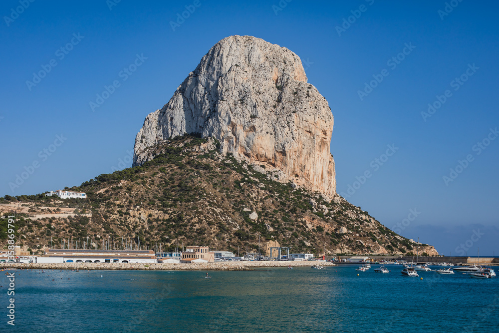 Summer view of Calpe town, Calp, with harbor and beach and Penon de Ifach mountain, Marina Alta, province of Alicante, Valencian Community, Spain Summer view of Calpe town, Calp, with harbor and beach and Penon de Ifach mountain, Marina Alta, province of Alicante, Valencian Community, Spain