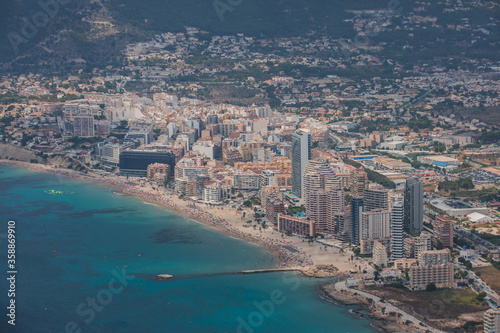 Summer view of Calpe town  Calp  with harbor and beach and  Penon de Ifach mountain   Marina Alta  province of Alicante  Valencian Community  Spain