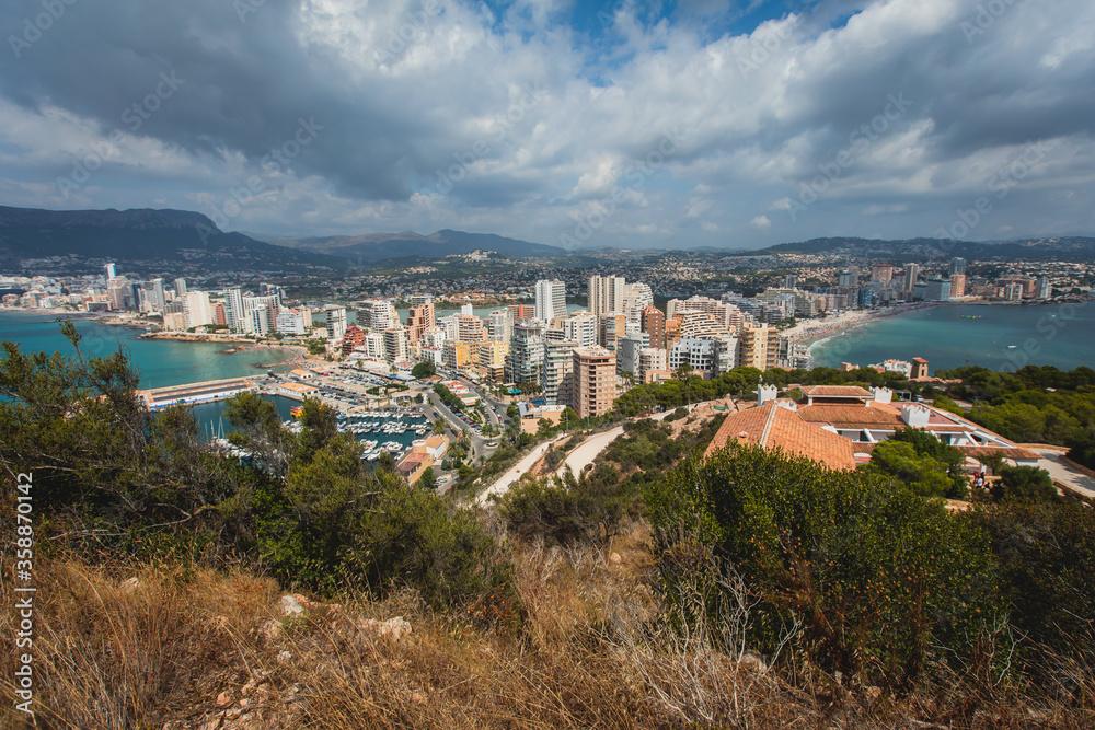 View of Calpe Calp town with Penon de Ifach mountain during the hiking to Penyal d'Ifac Natural Park, Marina Alta, province of Alicante, Valencian Community, Spain