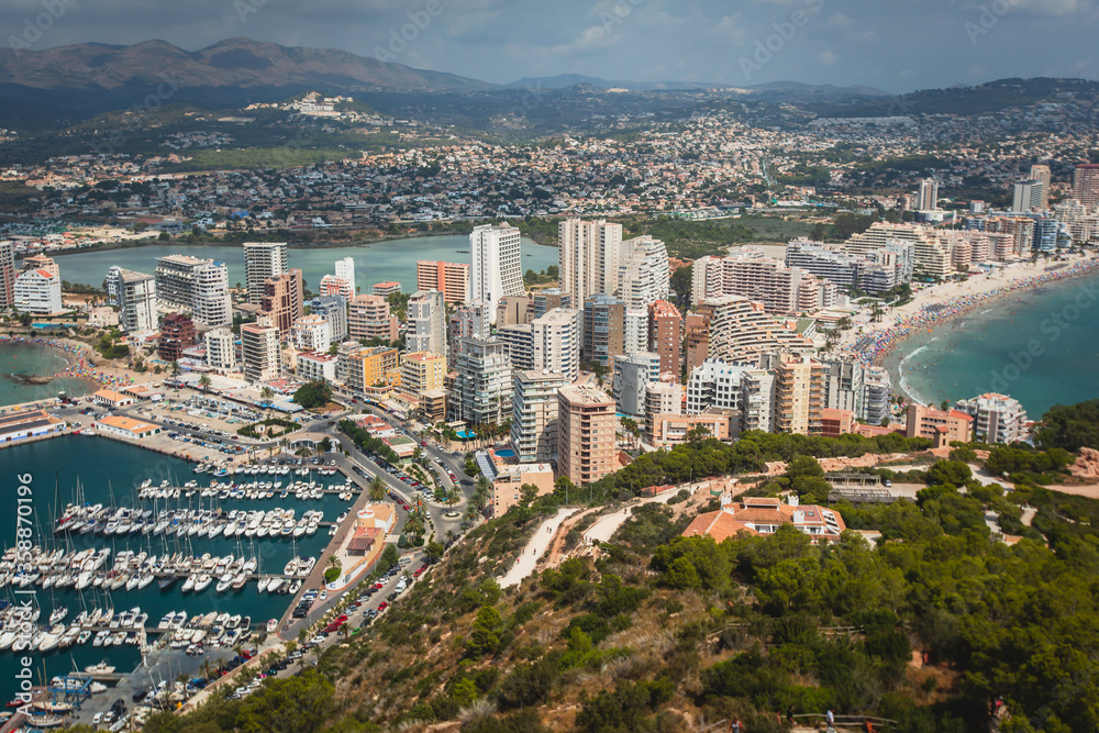 View of Calpe Calp town with Penon de Ifach mountain during the hiking to Penyal d'Ifac Natural Park, Marina Alta, province of Alicante, Valencian Community, Spain