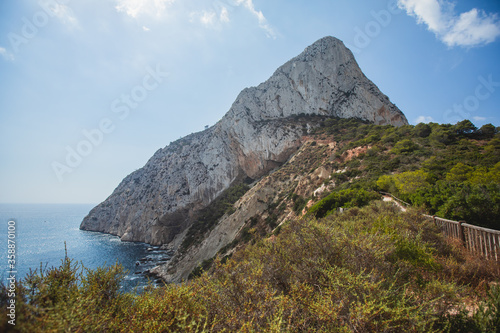 View of Calpe Calp town with Penon de Ifach mountain during the hiking to Penyal d'Ifac Natural Park, Marina Alta, province of Alicante, Valencian Community, Spain