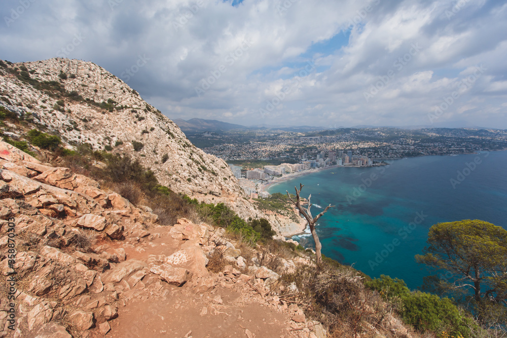 View of Calpe Calp town with Penon de Ifach mountain during the hiking to Penyal d'Ifac Natural Park, Marina Alta, province of Alicante, Valencian Community, Spain