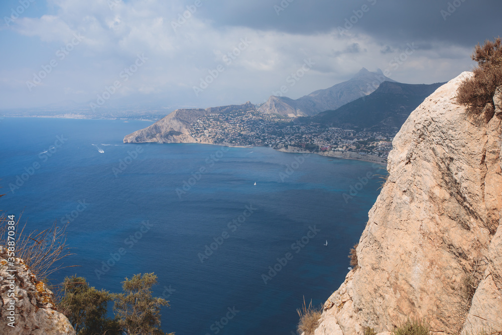 View of Calpe Calp town with Penon de Ifach mountain during the hiking to Penyal d'Ifac Natural Park, Marina Alta, province of Alicante, Valencian Community, Spain View of Calpe Calp town with Penon de Ifach mountain during the hiking to Penyal d'Ifac Natural Park, Marina Alta, province of Alicante, Valencian Community, Spain