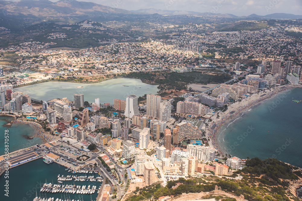 Fototapeta premium View of Calpe Calp town with Penon de Ifach mountain during the hiking to Penyal d'Ifac Natural Park, Marina Alta, province of Alicante, Valencian Community, Spain