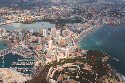 View of Calpe Calp town with Penon de Ifach mountain during the hiking to Penyal d'Ifac Natural Park, Marina Alta, province of Alicante, Valencian Community, Spain