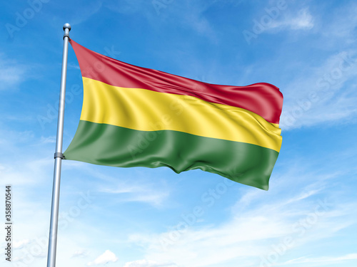 Bolivia flag on a pole against a blue sky background.