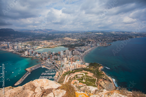 View of Calpe Calp town with Penon de Ifach mountain during the hiking to Penyal d'Ifac Natural Park, Marina Alta, province of Alicante, Valencian Community, Spain