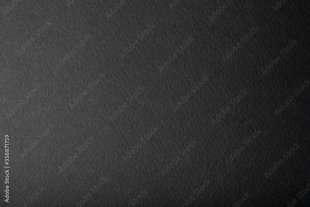 Close-up of sheet of black gradient paper texture